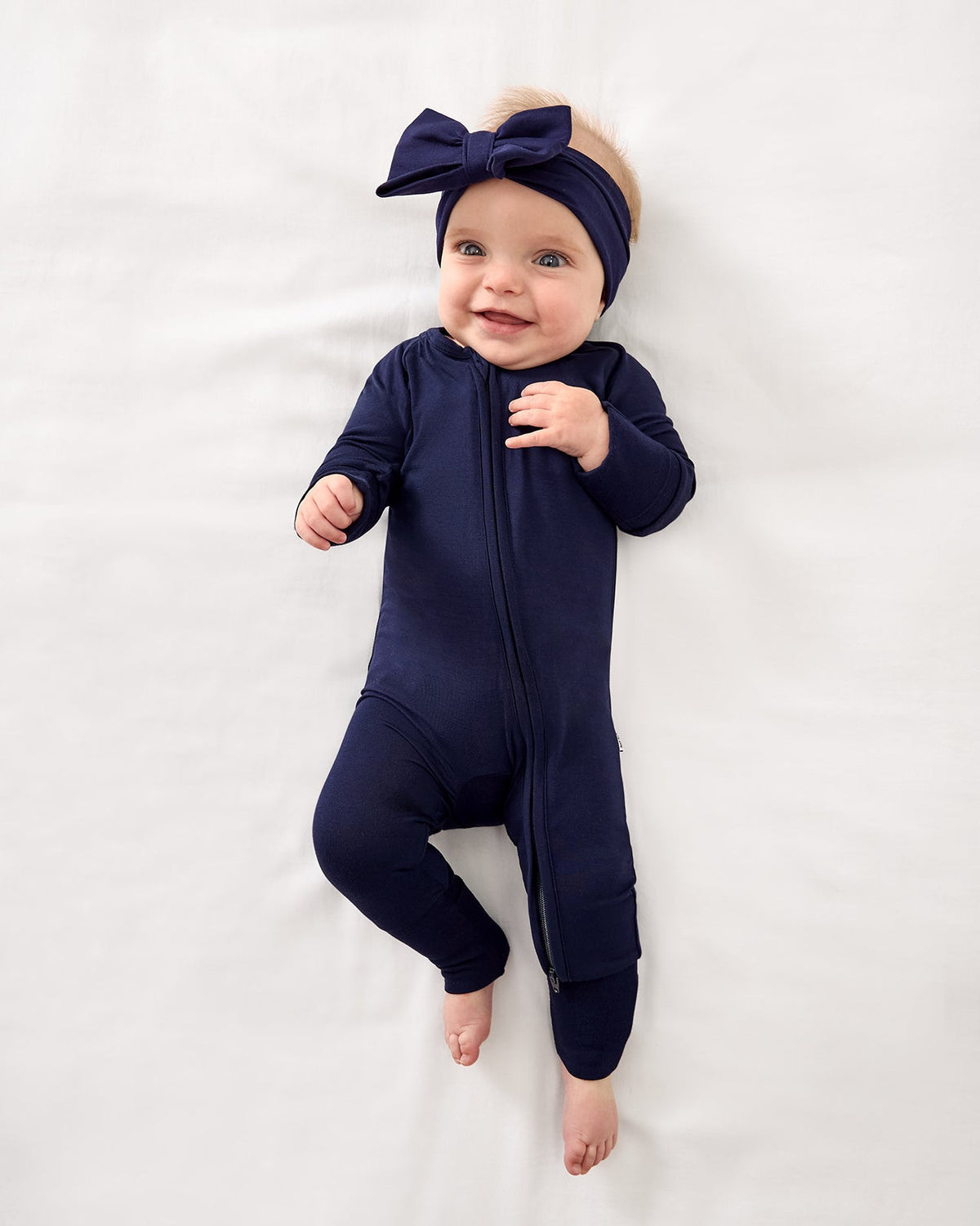 Baby wearing Classic Navy pajamas
