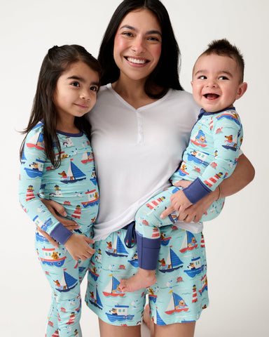 Mother and two children wearing matching Nautical Paws pajamas