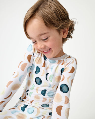 Close up of boy wearing the Luna Neutral Long Sleeve Two-Piece Pajama Set