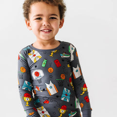 Child in Hoop Stars printed pajamas