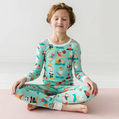 Child in Zen Zoo printed pajamas
