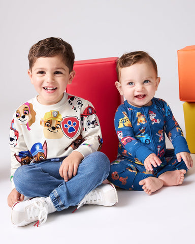 Two kids wearing PAW Patrol Little Sleepies daywear and pajama styles