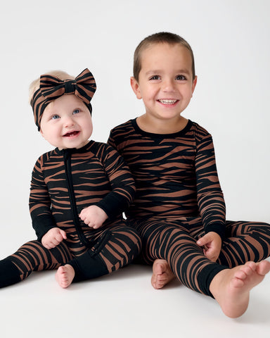 Two children wearing Wild Stripes PJs