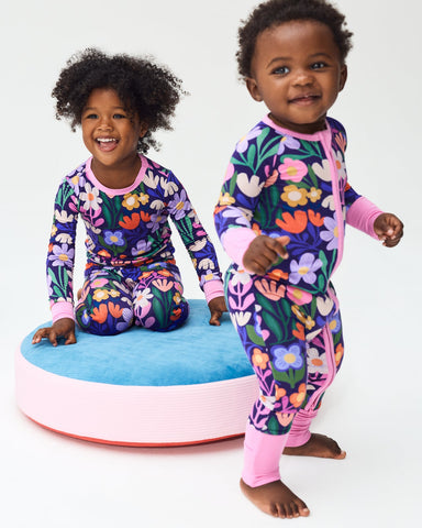 Two girls wearing matching Wild Garden pajamas