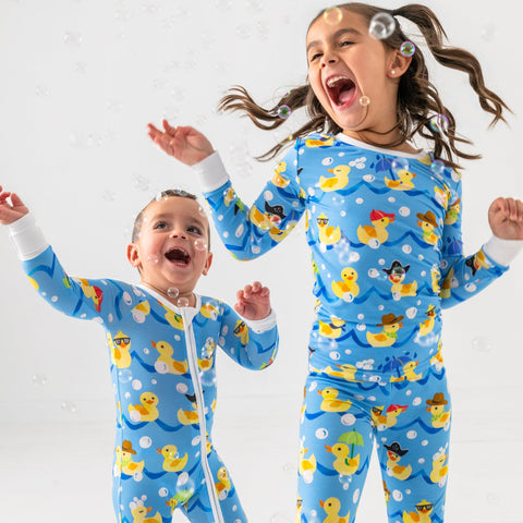 Two children wearing matching Splish Splash pajamas