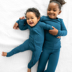 two children wearing matching Twilight Teal Pjs 