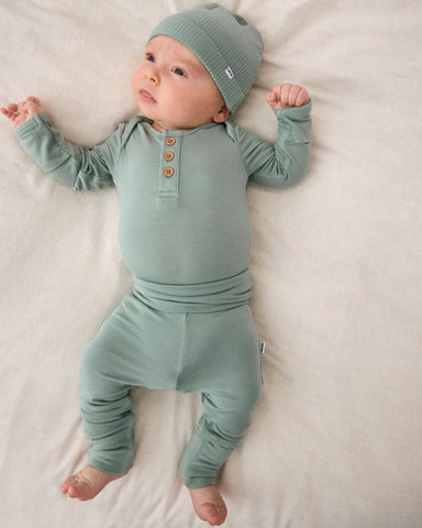 Baby boy wearing Willow green newborn clothing