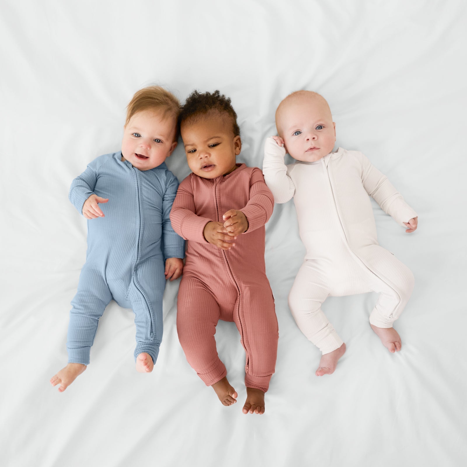 three children wearing matching ribbed solid zippys