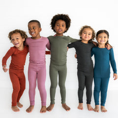 kids wearing a variety of Cozy pjs in Fall colors