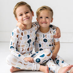 two boys wearing Luna Neutral pajama sets