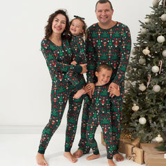 Family of four wearing matching Night at the Nutcracker printed pajama sets