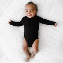 Child wearing a Black Bodysuit