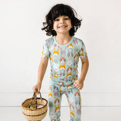 Toddler girl wearing Rad Rabbits long sleeve zipper romper pajamas.