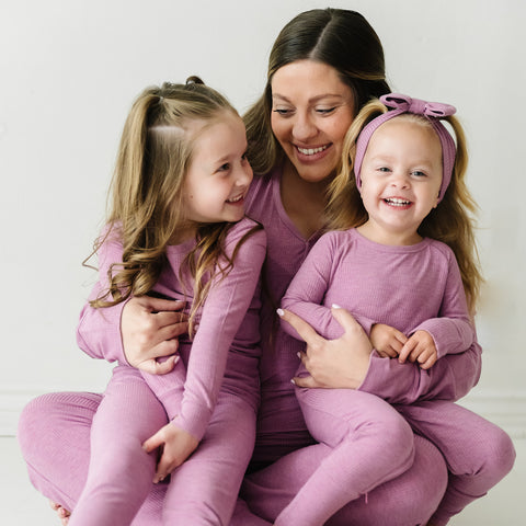 Mother and daughters wearing matching Heather Mulberry Ribbed pjs