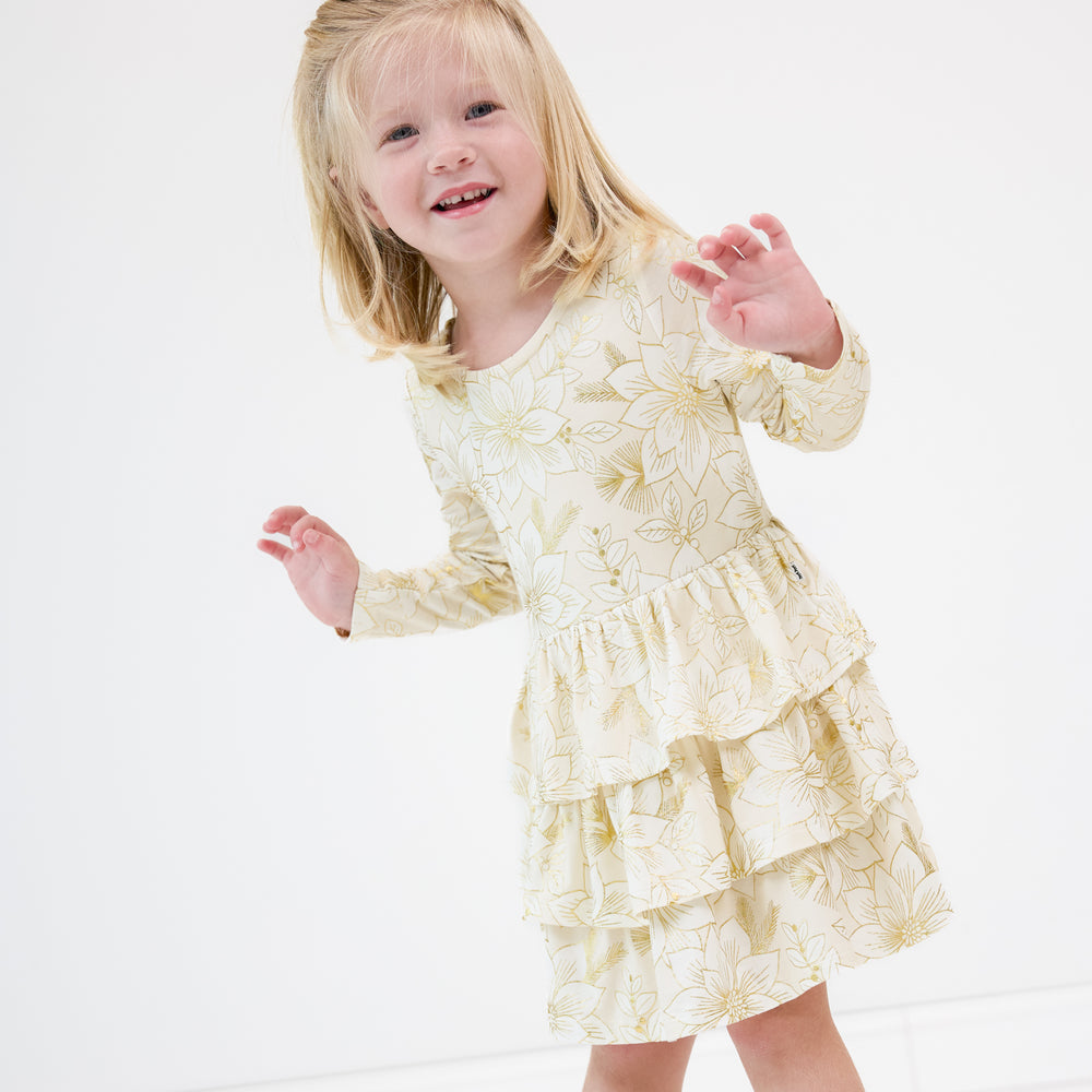 Image of a child wearing a Golden Blooms Tiered Tutu Dress with Bloomer