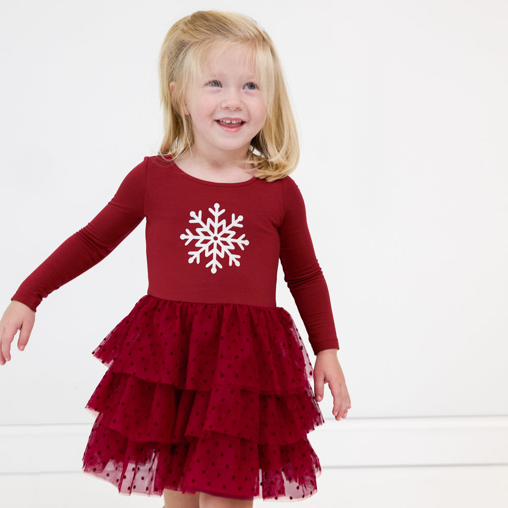 Child wearing a Snowflake Tiered Tutu Dress with Bloomer