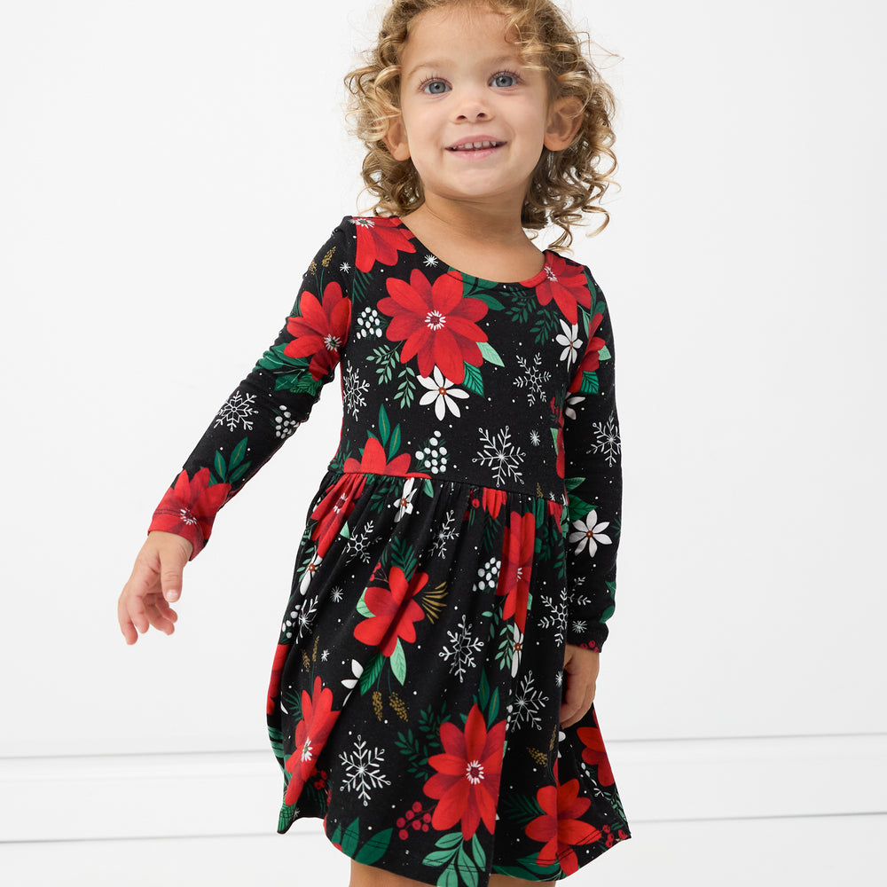 Child wearing a Snowy Blooms Bow Back Skater Dress with Bodysuit