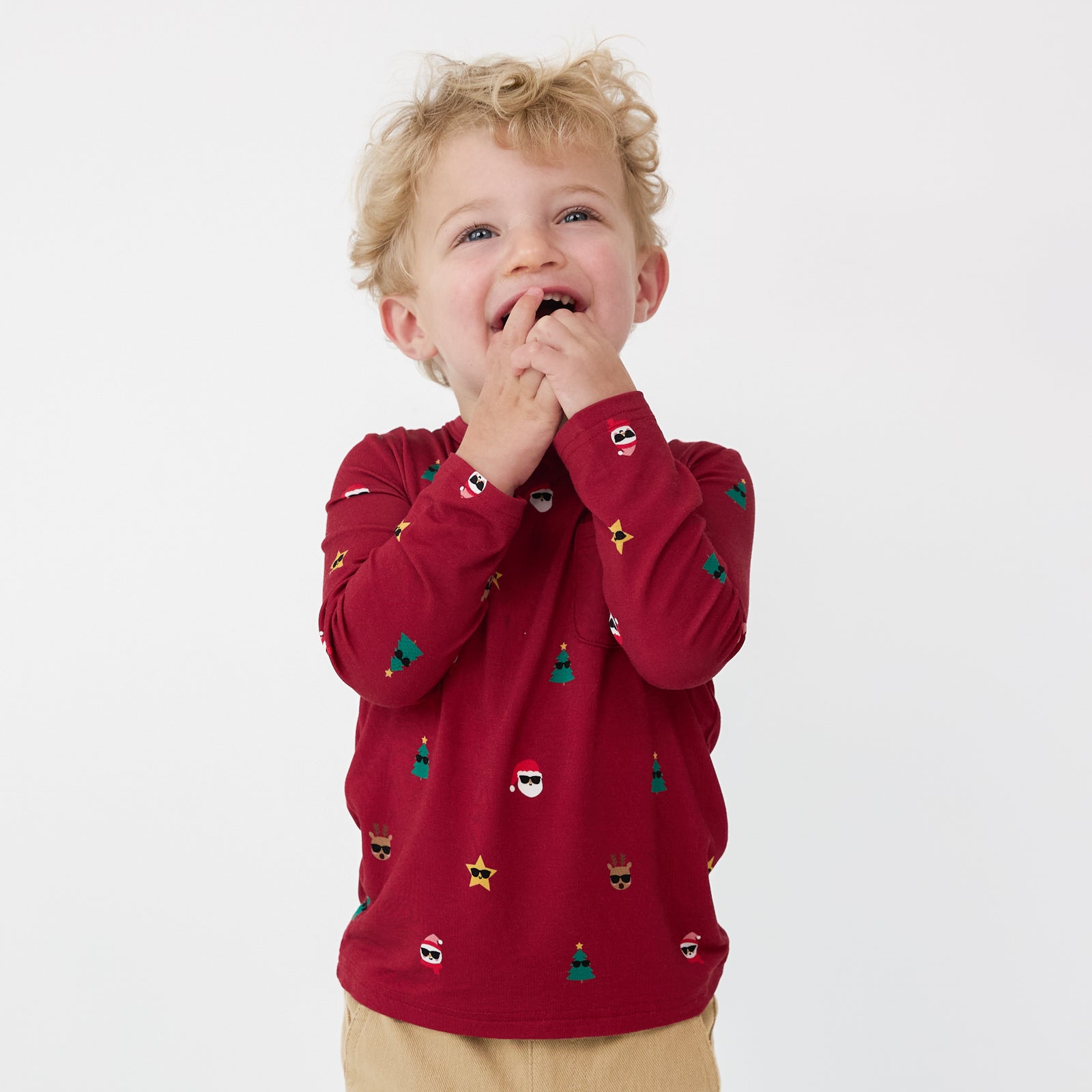 Close up image of a child wearing a Cool Christmas Pocket Tee