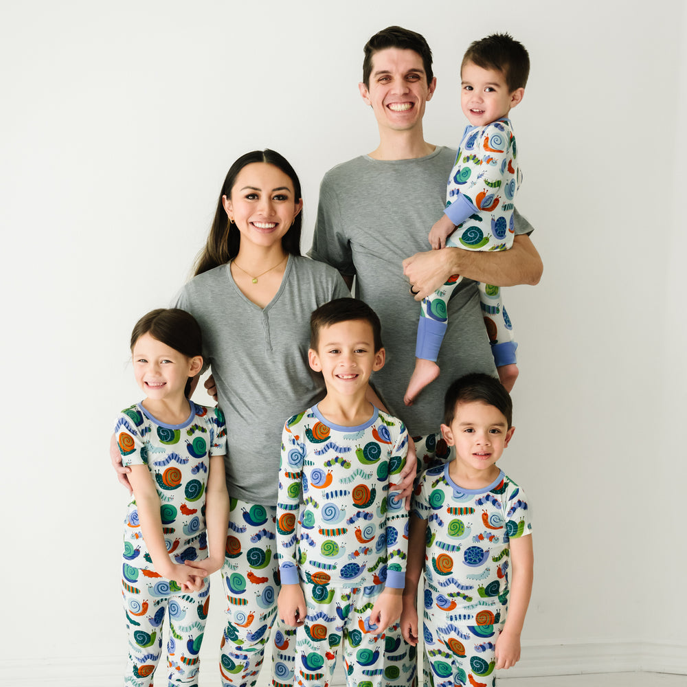 Family of six wearing matching pajamas