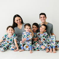 Family of six wearing matching Inchin' Along pajamas