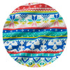A circular fabric swatch featuring a colorful Nordic and Christmas-themed pattern with snowflakes, reindeer, and geometric stripes in blue, red, teal, yellow, pink, and white.