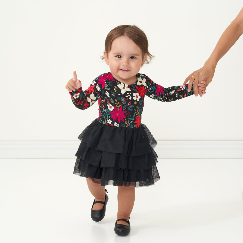 child holding her mom's hand wearing a Berry Merry Flutter Tutu Dress with Bloomer