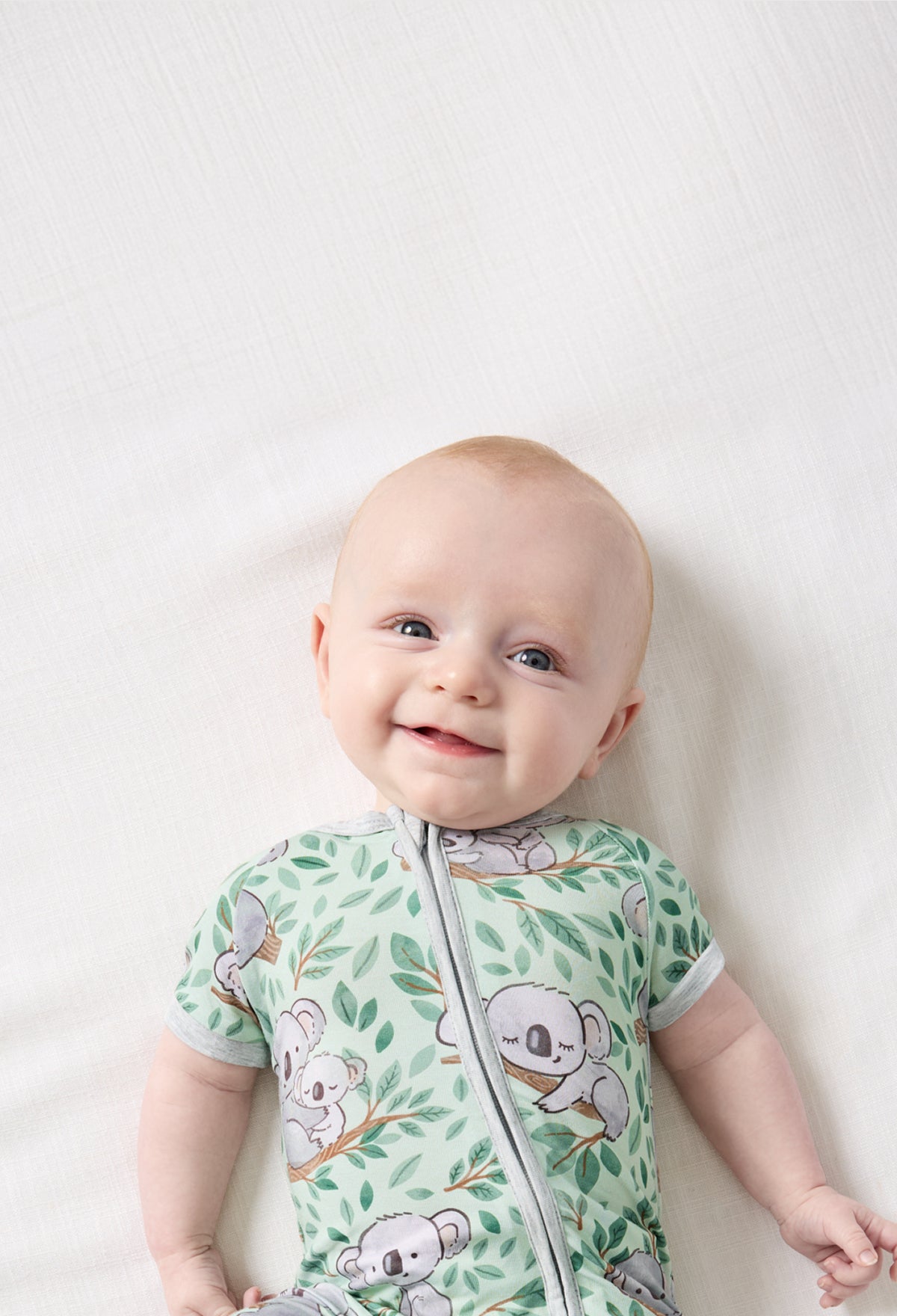 Baby wearing Koala Cuddles bamboo pajamas.