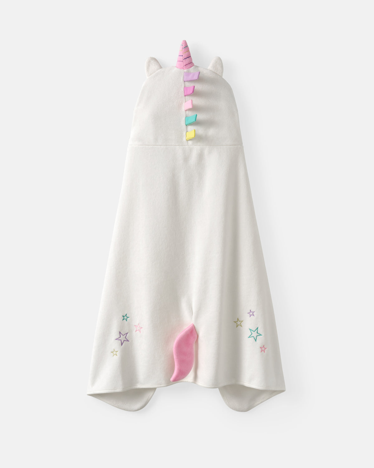 A white hooded baby towel or wrap with a pink unicorn horn, small white ears, pastel rainbow decorative tabs on the hood, and embroidered pastel stars near the bottom corners.