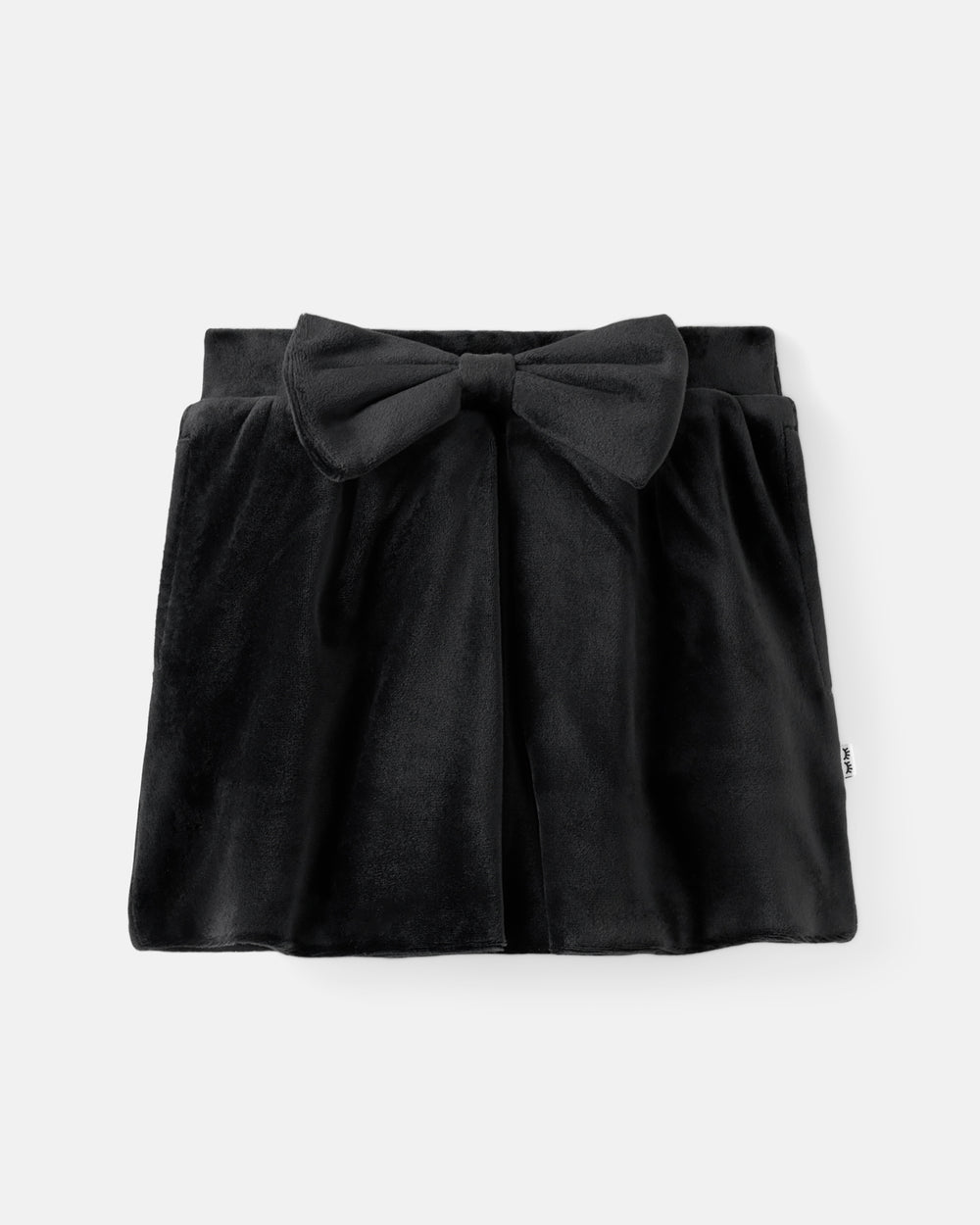 A black velvet mini skirt with a large bow at the front waist, displayed flat against a light gray background.