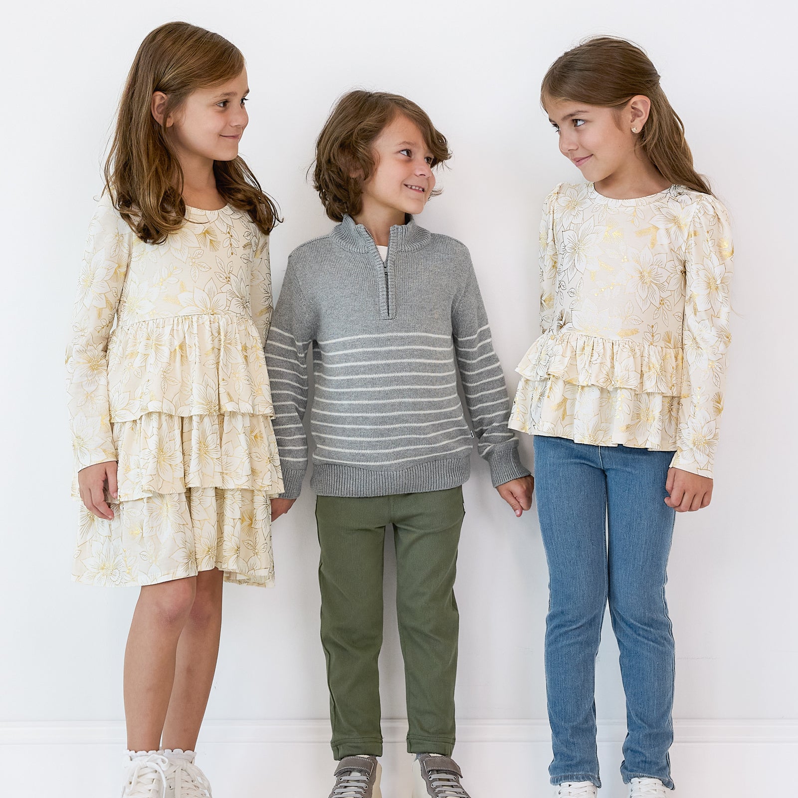 Three children wearing coordinating Holiday Play styles