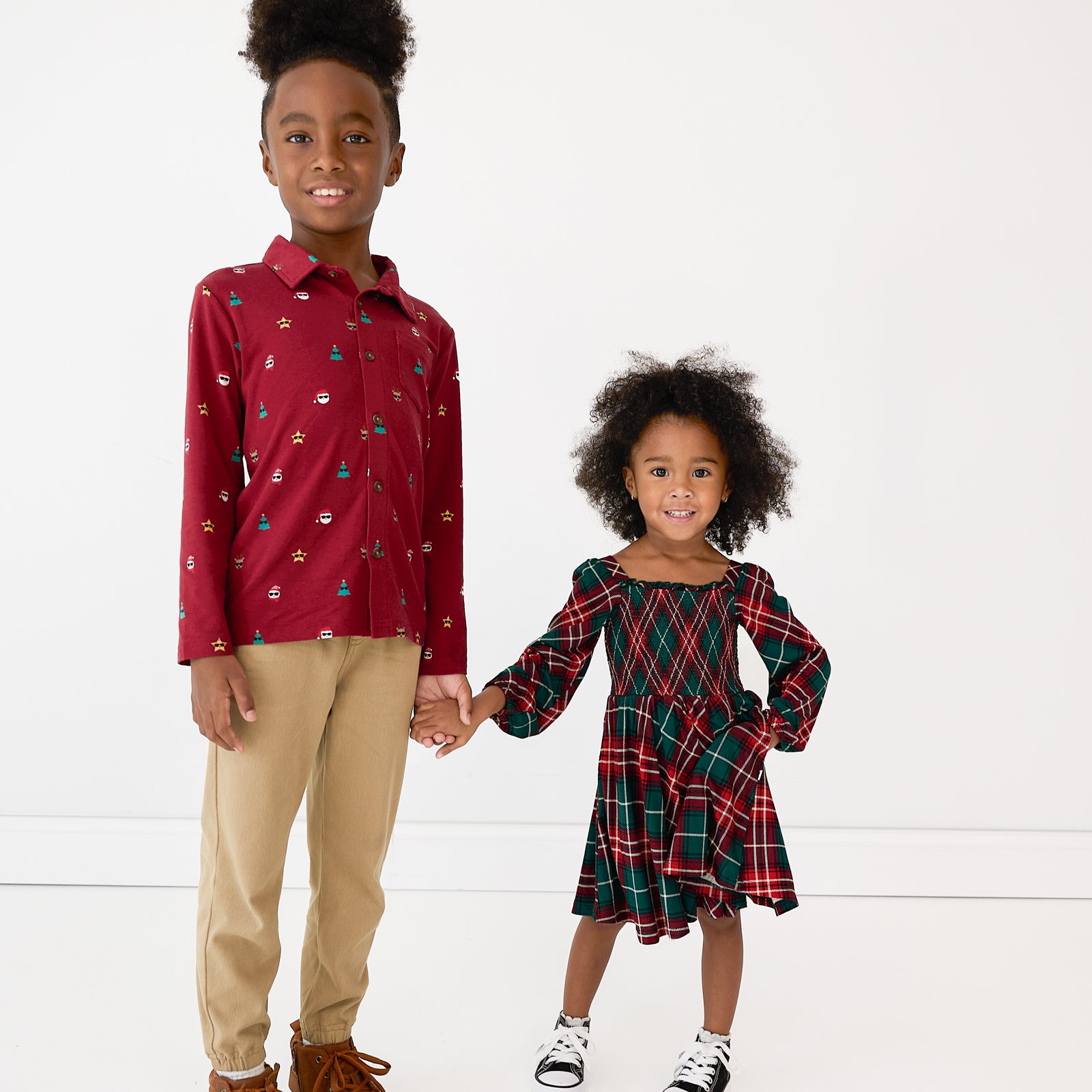 Two siblings wearing coordinating Holiday Play styles