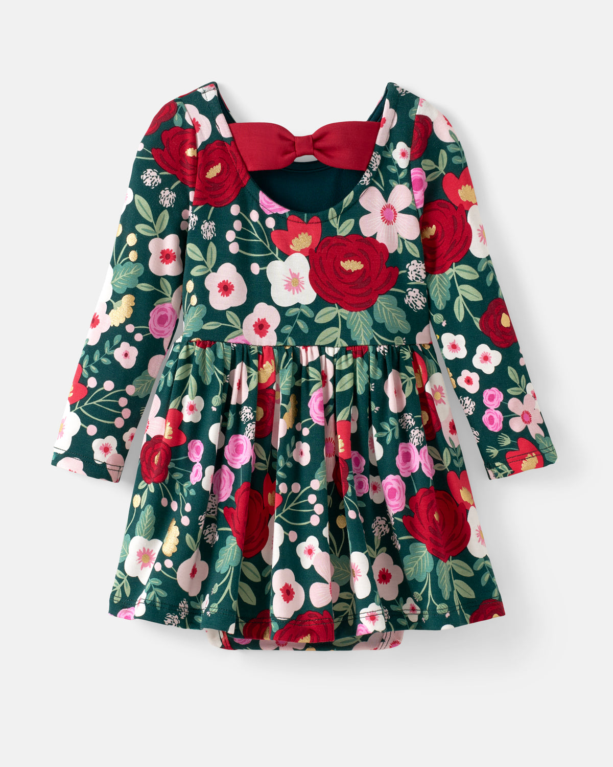 A long-sleeve baby dress with a dark green floral print featuring red, pink, and white flowers, a red bow at the neckline, and a flared skirt, shown on a light gray background.