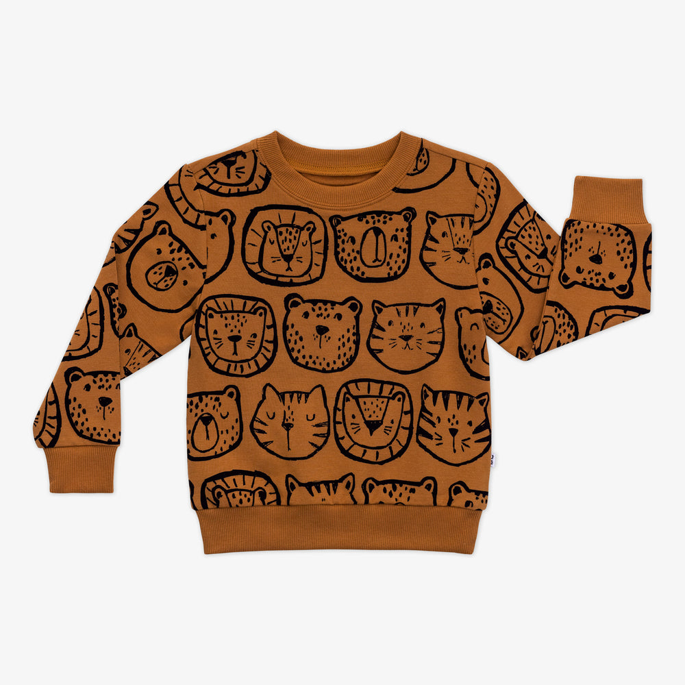 Flat lay of an Amber Lions, Tigers & Bears crewneck sweatshirt with black animal illustrations