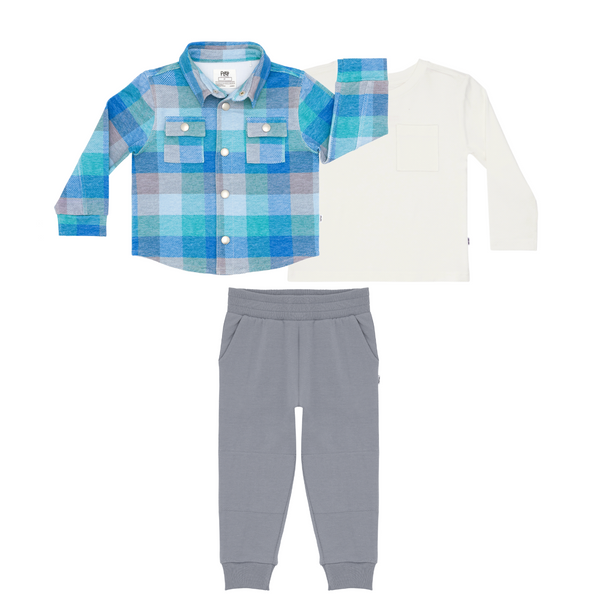 Flat lay composite of an Arctic Plaid Shacket, Soft White Long Sleeve Relaxed Pocket Tee, and Windy Sky Jogger