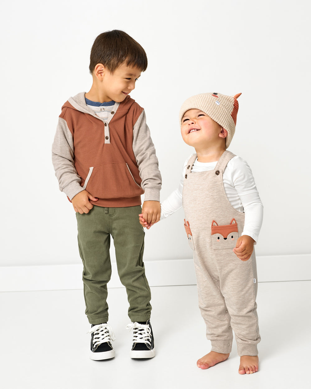 Two kids wearing styles from the Fall drop