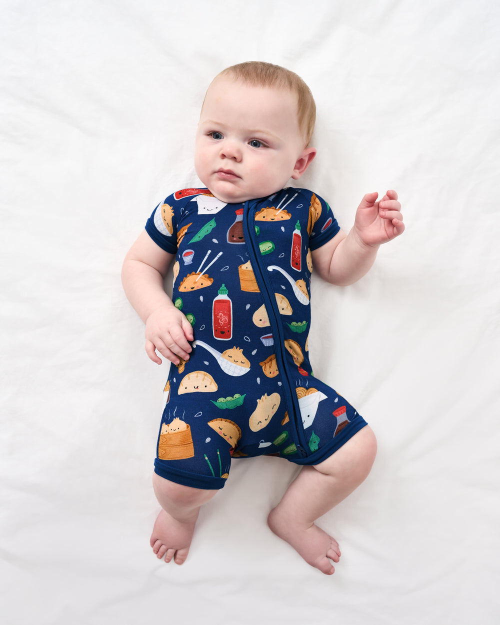 Aerial view of baby wearing the Bao Buddies Shorty Zippy