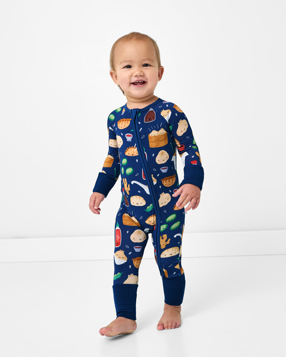 Standing toddler wearing the Bao Buddies Zippy
