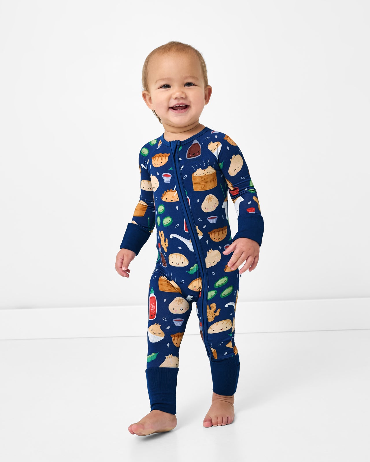 Standing toddler wearing the Bao Buddies Zippy