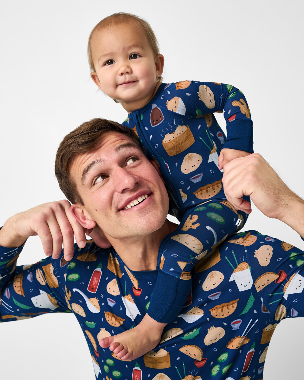 Father and son wearing matching Bao Buddies bamboo pajamas