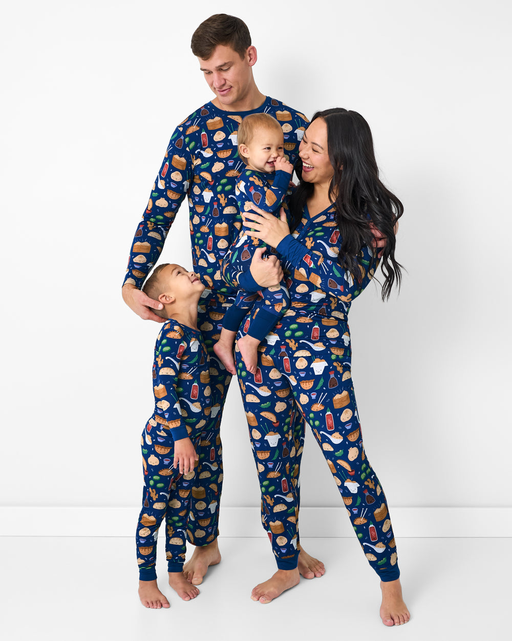 Family of four wearing matching Bao Buddies bamboo pajamas