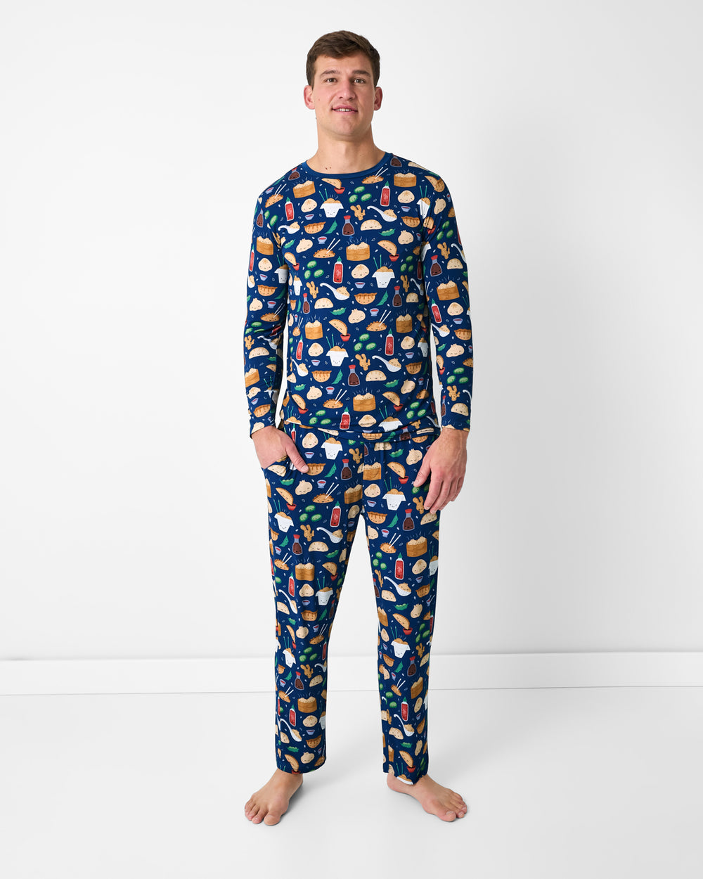 Standing man wearing the Bao Buddies Men's Pajama Pants and Top