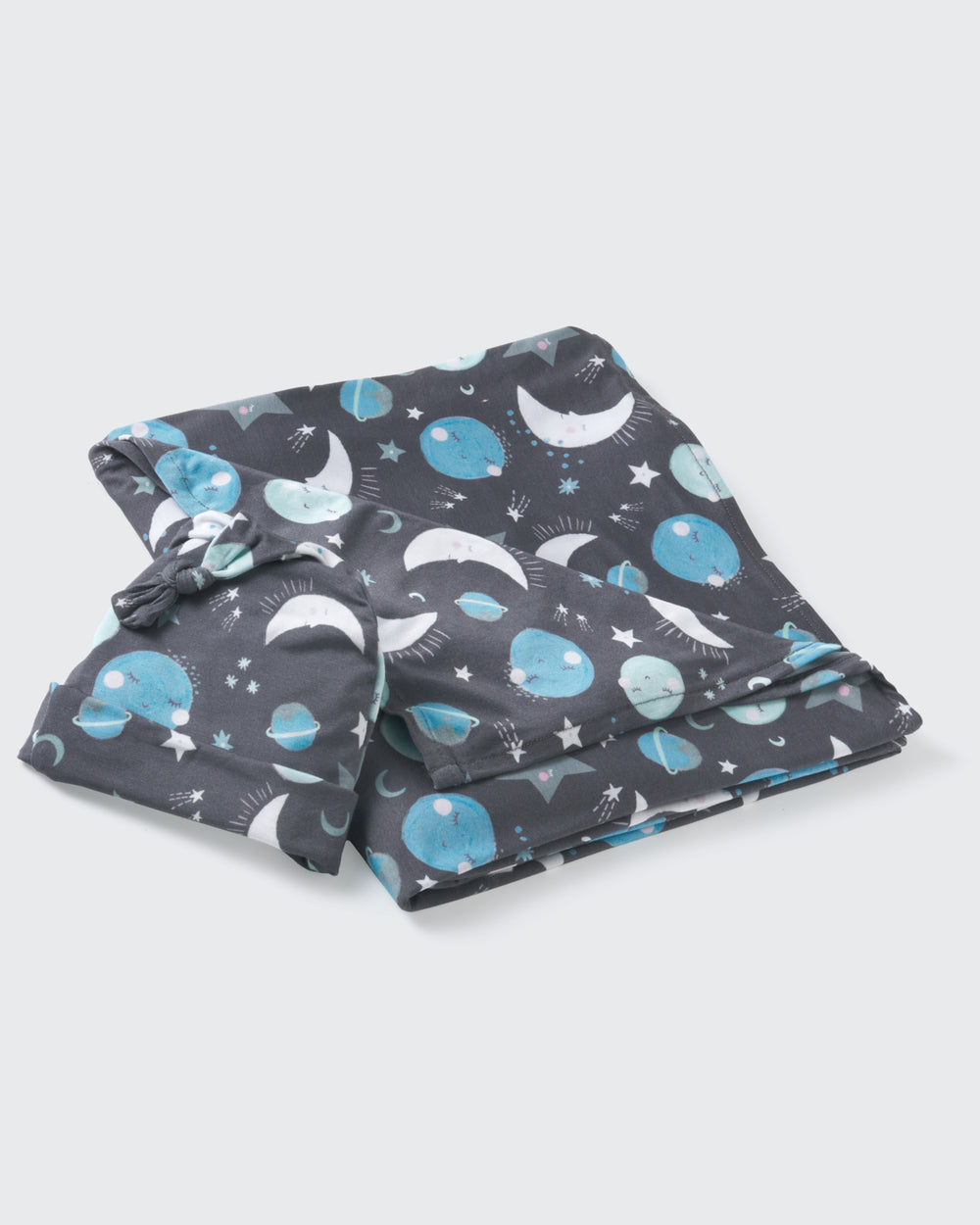 Flat lay of the Blue To the Moon & Back Swaddle & Hat Set