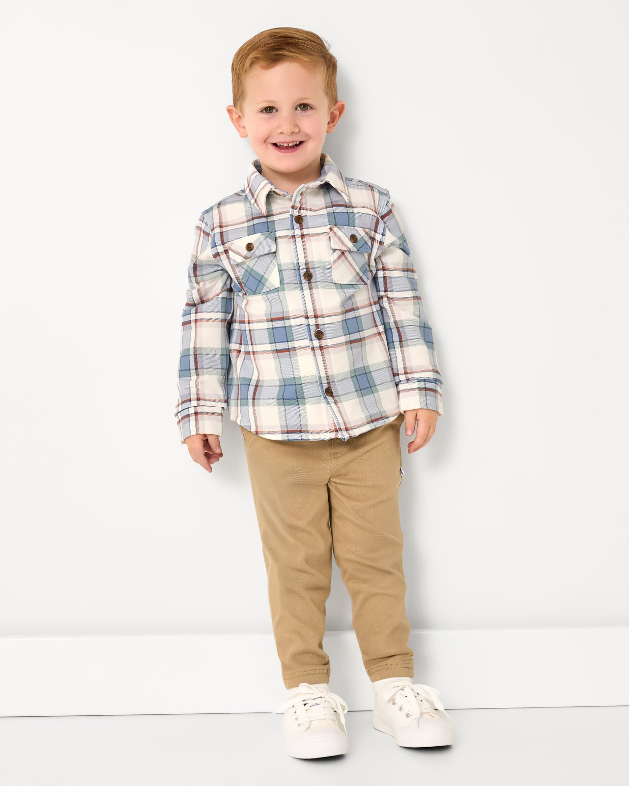 Boy wearing the Blue Ridge Plaid Shacket with khaki pants