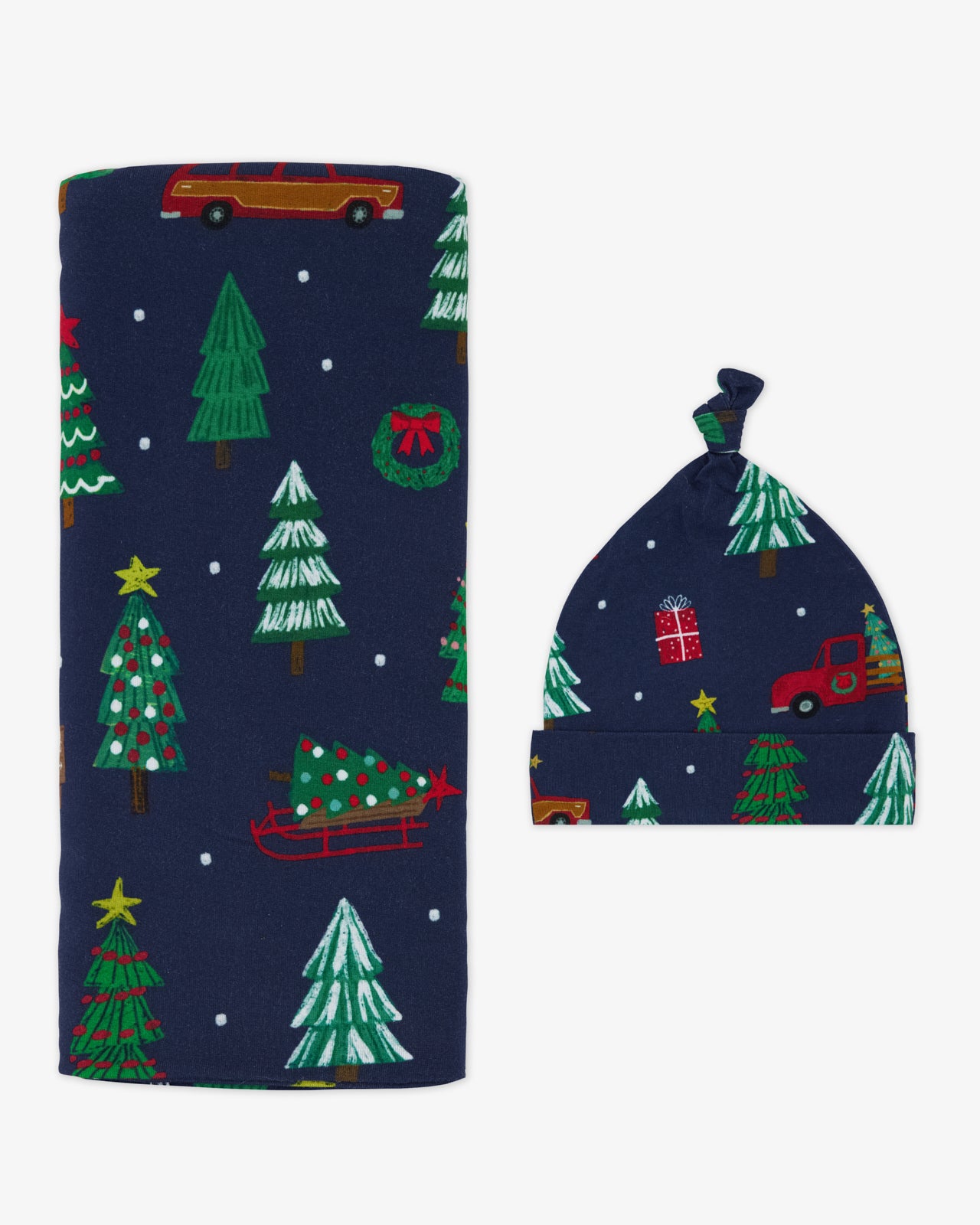 Flat lay of the Navy Tree Traffic Swaddle & Hat Set