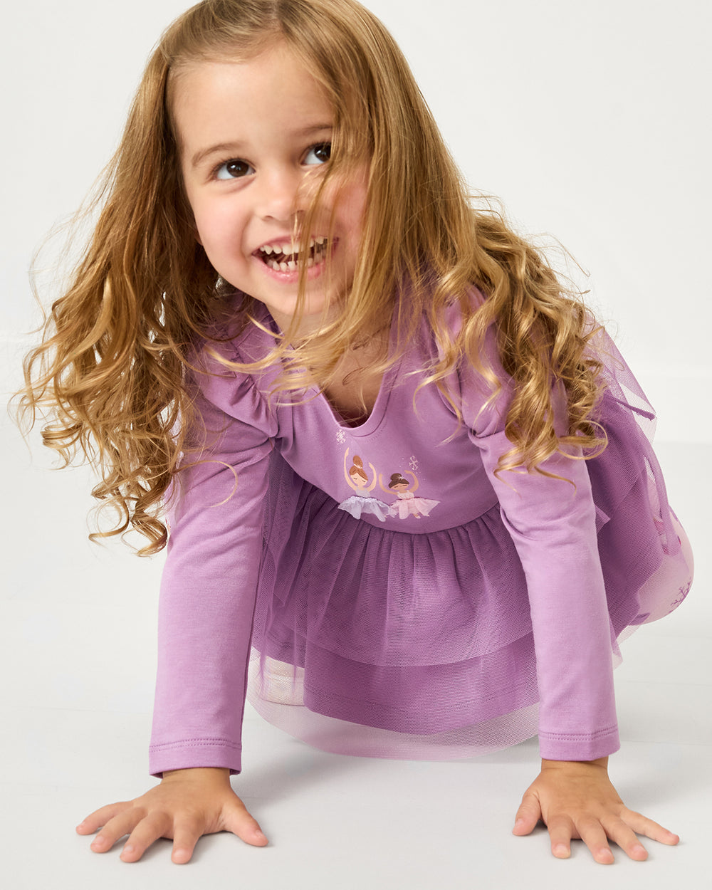 Crawling girl wearing the Ballerina Tiered Peplum Top