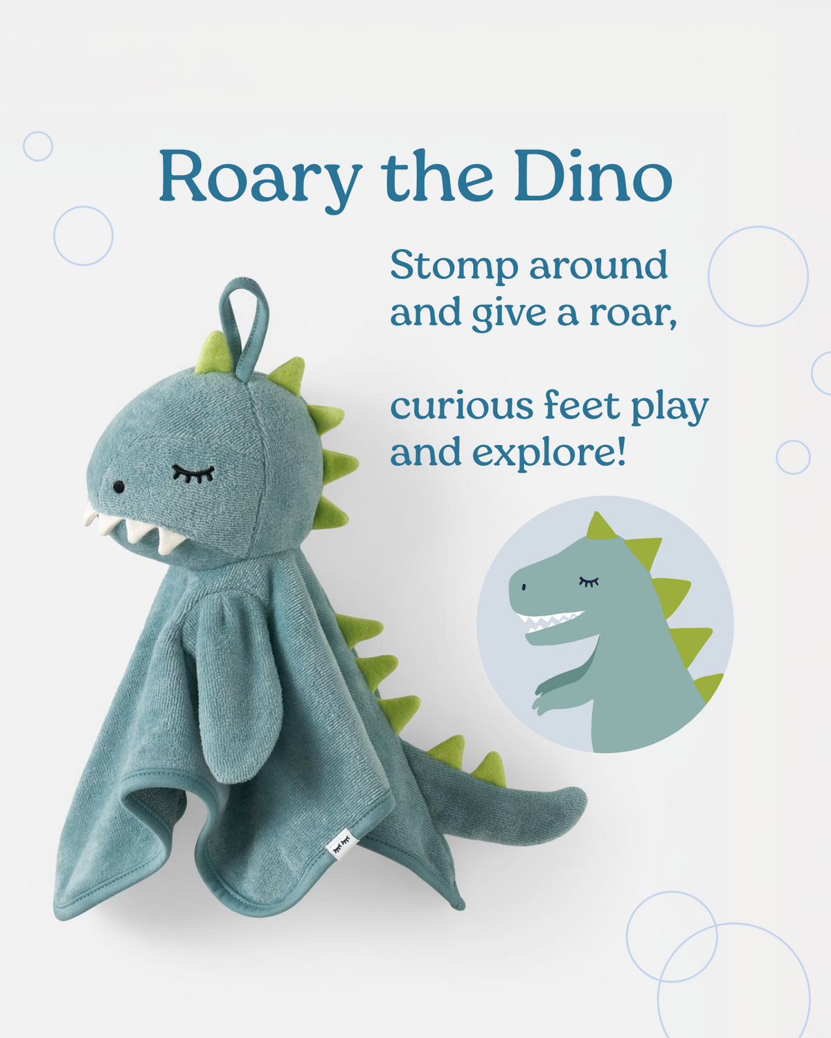 A plush dinosaur baby towel toy named Roary the Dino, featuring a dusty blue-green body, lime green spikes, and a matching hanging loop, shown on a light gray background with product text and a circular inset illustration.