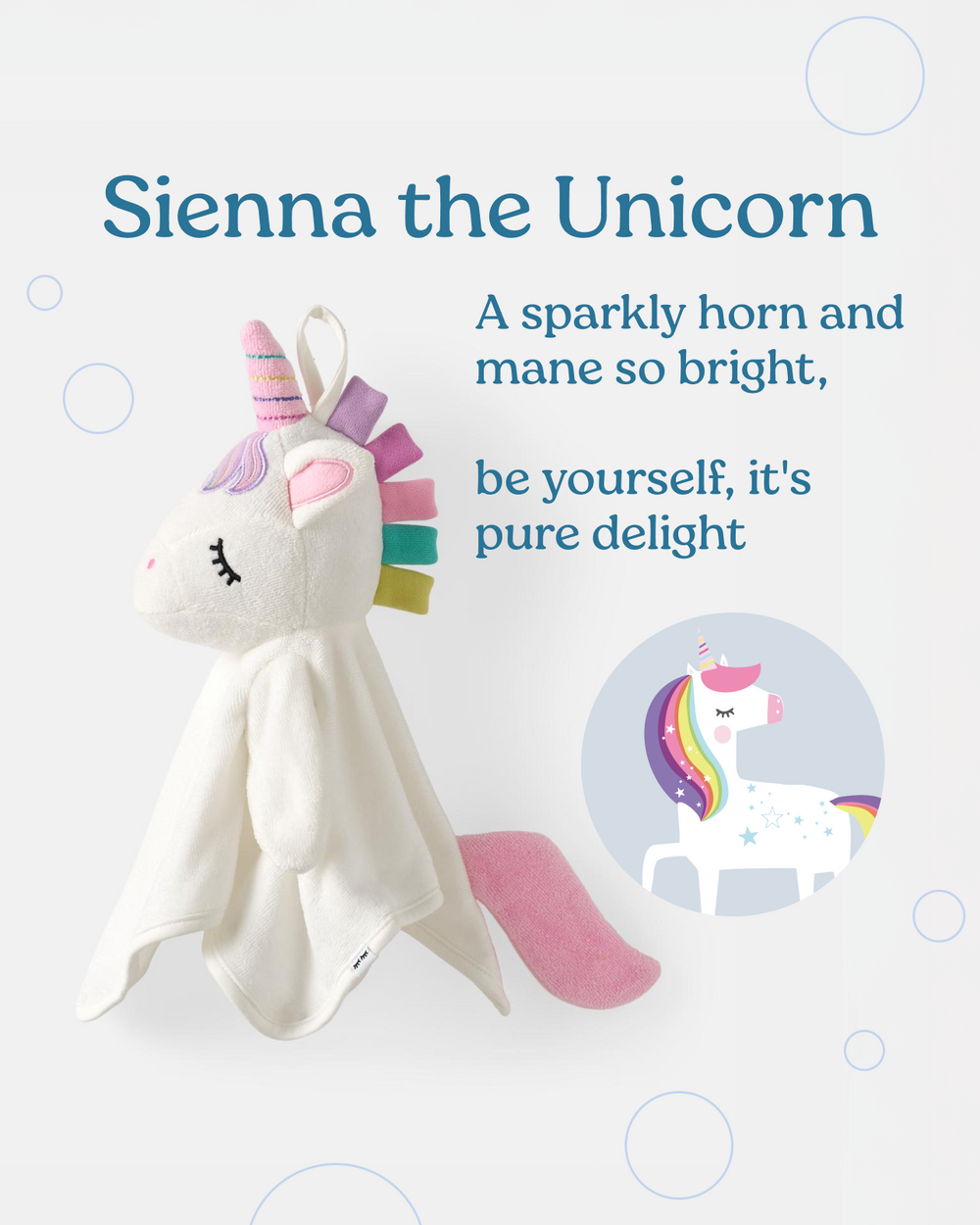 A plush unicorn comforter toy named Sienna the Unicorn, featuring a white fabric body, pink horn, pastel rainbow mane, and pink tail, shown on a light gray background with product text and a circular inset illustration.