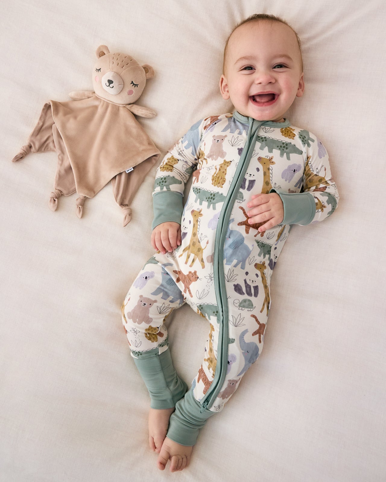 Aerial view of baby laying with the Bear Sleepyhead Lovey
