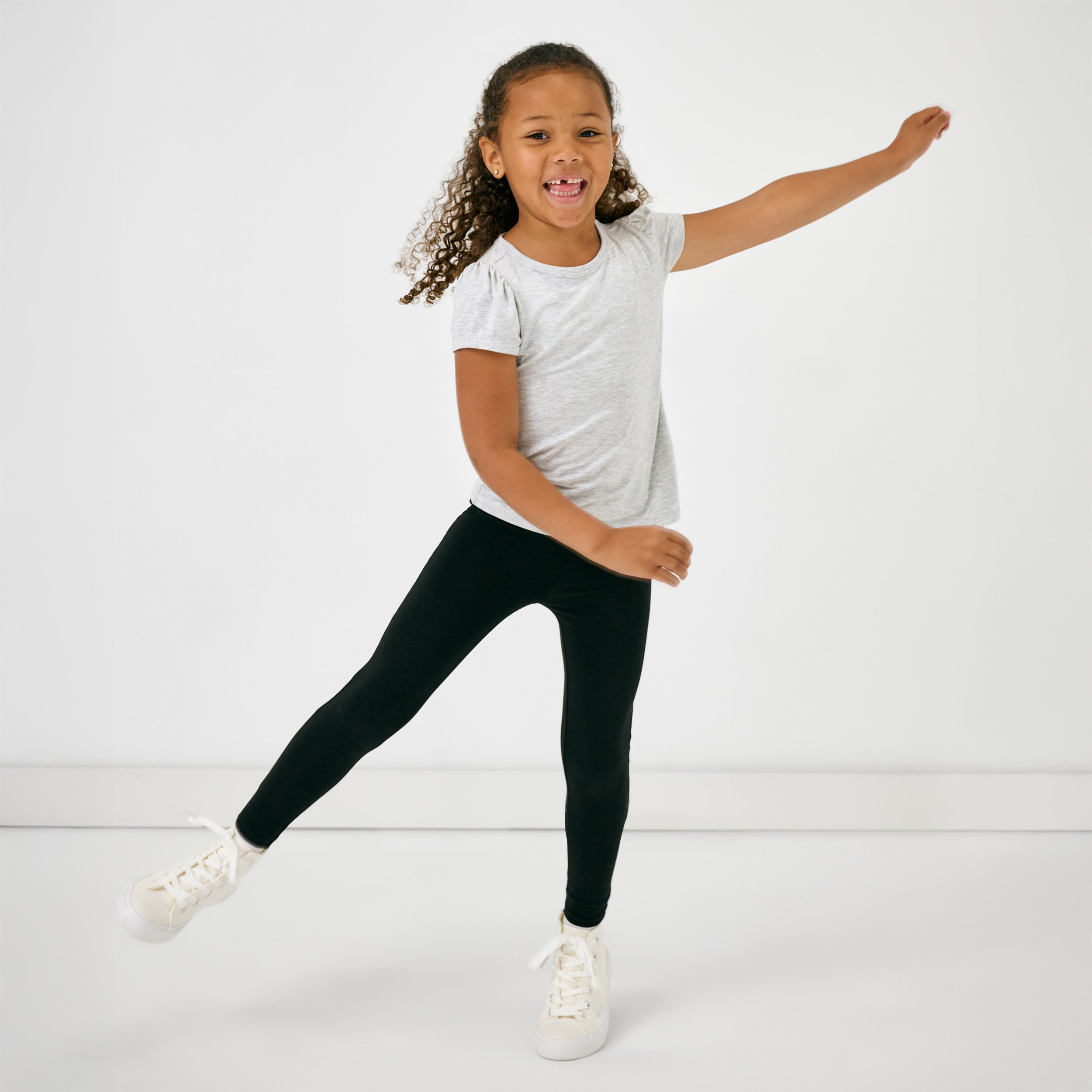 Child in motion wearing the Black Legging