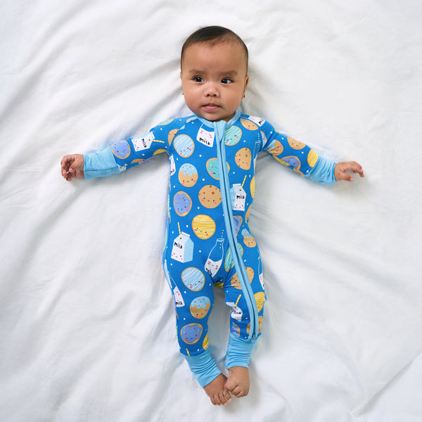 Aerial view of baby wearing the Blue Cookies & Milk Zippy